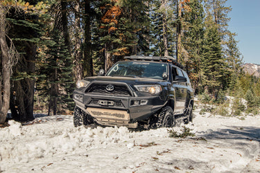 AFN 4x4 Accessories Front Bumper for Toyota 4Runner, designed for off-road adventures in snowy terrain